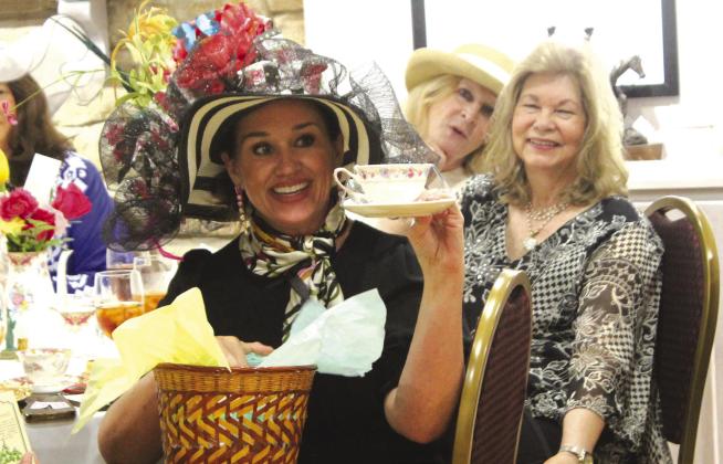 Mandy McCoy (left) took home not only 'Best Hat' by popular choice but also a tea set prize during the annual Bosque Museum's Docent's Tea and Style Show on Saturday, May 11. The fundraiser featuring fashionistas was re-scheduled a week due to flooding that prevented travel the Sunday prior. Nathan Diebenow | The Clifton Record