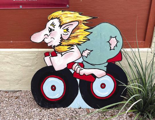Nathan Diebenow | The Clifton Record A cartoon troll riding on a bicycle greets visitors to historic downtown Clifton.