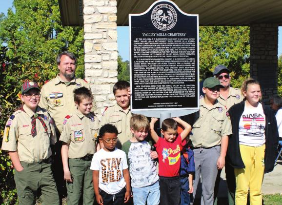 Above, Valley Mills Scout Troop 480 takes part in the Texas Historical Marker dedication ceremony for Valley Mills Cemetery. The scouts led those gathered Saturday afternoon in the pledge to the American flag. Below, Ruth Crawford shares the history of Valley Mills and Valley Mills Cemetery, as researched and written by Valley Mills Cemetery Association member Jo Nell Meyer before she passed away in 2020. Ashley Barner | Meridian Tribune