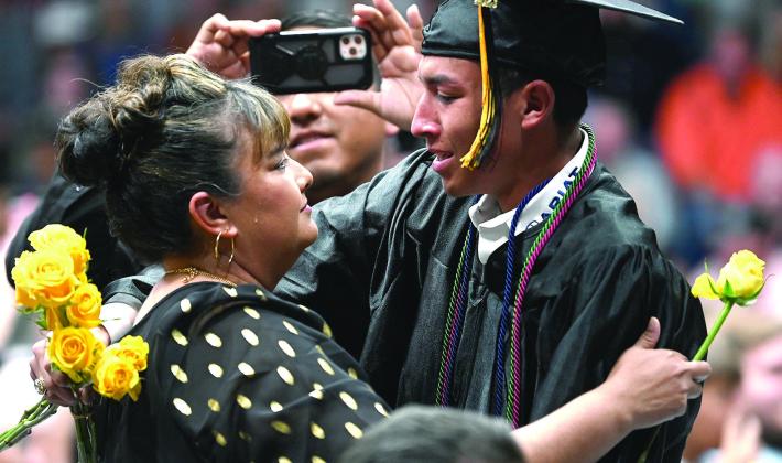 Proud mother Carmen Rodriguez receives a yellow rose from her son 2023 Meridian High School graduate Alejandro Rodriguez Jr. during the Meridian ISD commencement ceremony last Friday, May 26. Photos Courtesy of Simone Wichers-Voss / Southern Cross Creative