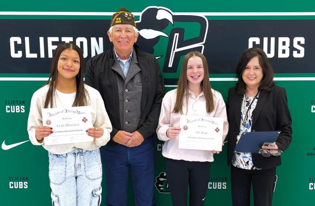 Jose Cano, vice commander of Veterans of Foreign Wars Post #8553, (center left) presented Clifton High School Freshmen Lean Martinez (far left) and Alli Hunt (center, right) with first place awards for their Voice of Democracy essay contest entries on Thursday, January 17. Their English teacher Gaye Lynn Seawright (far right) also accepted an award for the VFW post’s “Teacher of the Year.” Nathan Diebenow | The Clifton Record