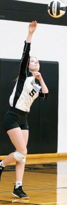 Lady Jacket junior Journey Stauffer (5) delivers a serve against Covington. Photo courtesy of The Sports Buzz