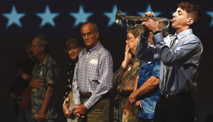 Photo Courtesy of Chisholm Country magazine Jacob Nickel played Taps at the Missing in Action Memorial/Project Recover fundraiser May 5 at the CISD Performance Arts Center.