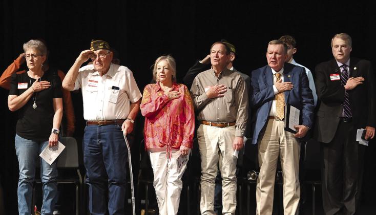 Photo Courtesy of Chisholm Country magazine Special guests to the Missing in Action Memorial/Project Recover fundraiser May 5 at the CISD Performance Arts Center Sherry Shulze, David Conrad, Steve Conrad and his wife, field representative for U.S. Senator John Carter Michael McCloskey and District 22 Texas Senator Brian Birdwell stand for the national anthem.