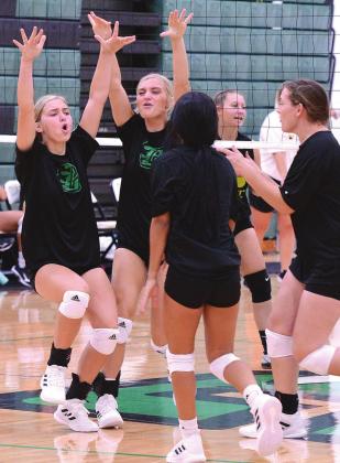 Left, Clifton Lady Cubs celebrate at the net as they prepare to return to the court this season. Photos Courtesy of Brett Voss’ THE SPORTS BUZZ