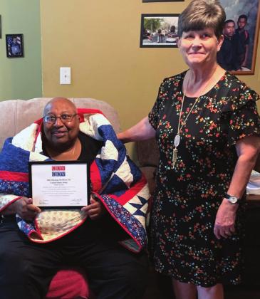 Thomas Oliver receives a Quilt of Valor from Debbie Stubbs for his service and sacrifice in Vietnam. Courtesy Photo