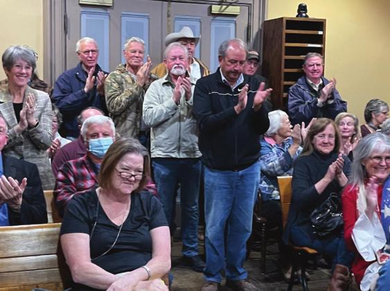 Bosque County residents applaud the decision by the commissioners court to pass a resolution denying tax abatements to wind energy companies looking to build in the county. Ashley Barner | Meridian Tribune