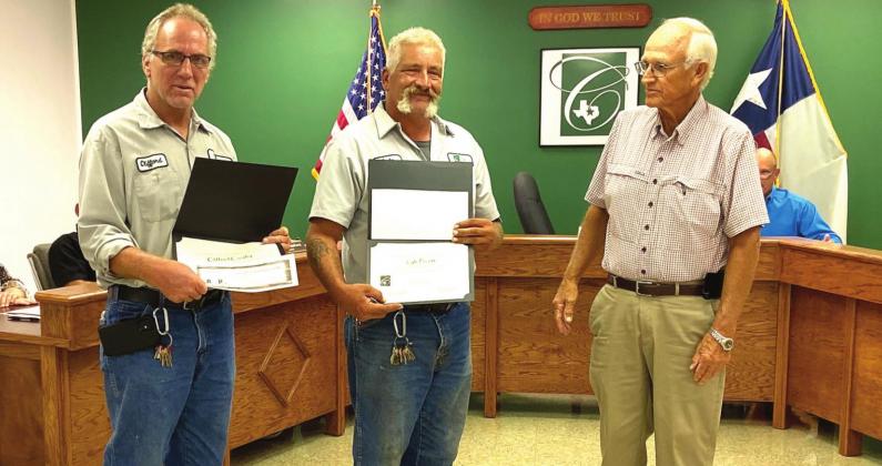 From left, city staff members Clifford Crosby and Lyle Pruett were recognized at August’s Clifton City Council meeting for their dedication to the community when a lightning strike took the city’s water system offline. Shown with the men is Mayor Richard Spitzer. Jennifer Gordon | The Clifton Record