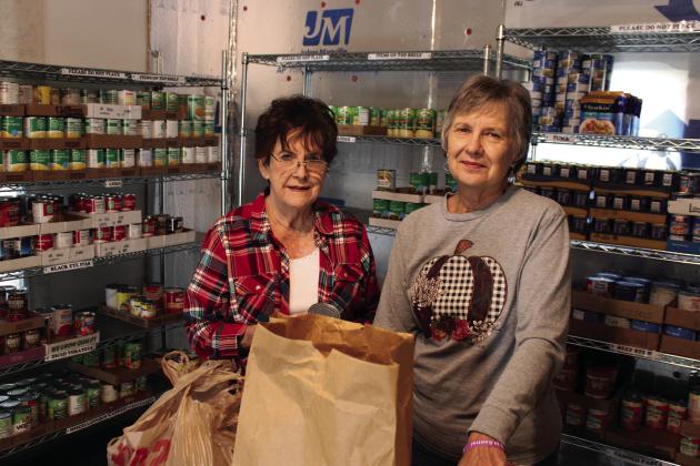 Clifton Food Bank volunteers Janey Glass and Betty Lou Powers pack items in the storeroom for a local family. The donation-based organization serves those in need in the 76634 zip code area. Ashley Barner | The Clifton Record