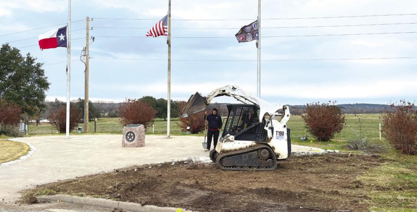 Work began to prepare the site of Bosque County Veterans Memorial on Wednesday, December 13, in Meridian. Mark Juarez and his helper Warren of 5 Star Concrete started the process by removing dirt and rock on the site. Nathan Diebenow | Meridian Tribune
