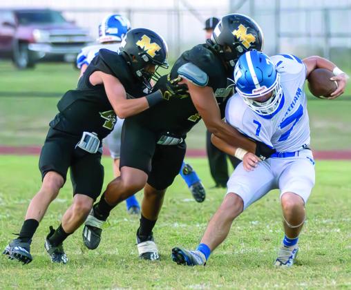 Photos by Wendy Orozco courtesy of Brett Voss’ The Sports Buzz Yellowjackets take the field against Wortham (far left); John Wyatt (1) and Alex Rodriguez (4) make the tackle (above).