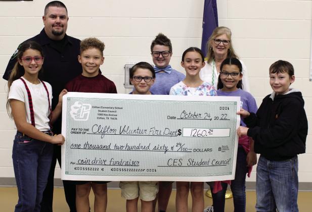 Representing Clifton Elementary School is the fifth grade student council, from left Lily Domel, Cole Isaacs, Jaxson Moran, Corbin Salome, Lillian Sibley, Mariella Alvarez and Easton Jones. The student council presented a check to the Clifton VFD after the school’s week-long fundraiser. Back row is Chris Blanton representing the Clifton VFD and CES Student Council advisor Sally Bekken. Ashley Barner | The Clifton Record