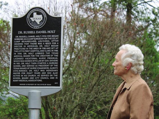 Dr. Holt’s daughter, Judy Holt McNeill, admires the new historical marker placed at Meridian Cemetery to honor the life and legacy her father left behind. Ashley Barner | Meridian Tribune