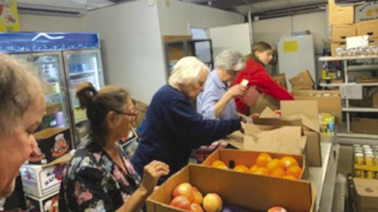 Volunteers with North Bosque Helping Hands Food Pantry filled 99 Christmas gift baskets with food items for families participating in the area Angel Tree program on Friday, December 15, 2023. Courtesy Photo by North Bosque Helping Hands