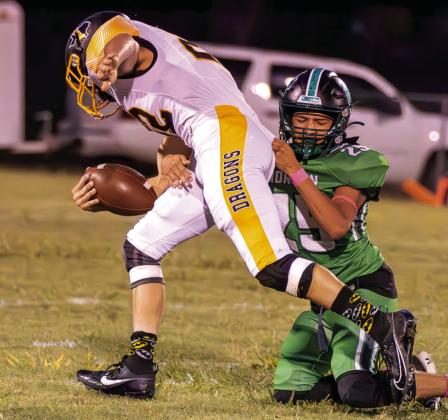 Iredell sophomore Cole Heutzenroeder (22) fights through tackle against Morgan. Photo by Wendy Orozco courtesy of Brett Voss’ The Sports Buzz