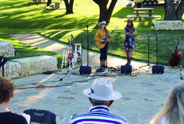 Crowd favorites Kristyn Harris and Hailey Sandoz liven up the amphitheater Saturday evening at the Bosque Museum’s Lomax Gathering in Meridian. Ashley Barner | The Clifton Record