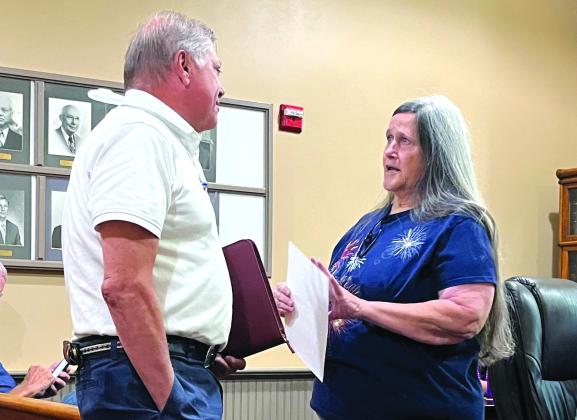 Bosque County auditor Jesse Jobes and Bosque County tax assessor/collector Arlene Sweeney (from left) chat after a recent Bosque County Commissioners Court meeting in Meridian. Nathan Diebenow | Meridian Tribune