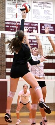 Lady Cub senior Kate Humphreys (9) works the net in Class 3A Bi-District playoff against Palmer in Hillsboro. Photo courtesy of Brett Voss’ The Sports Buzz