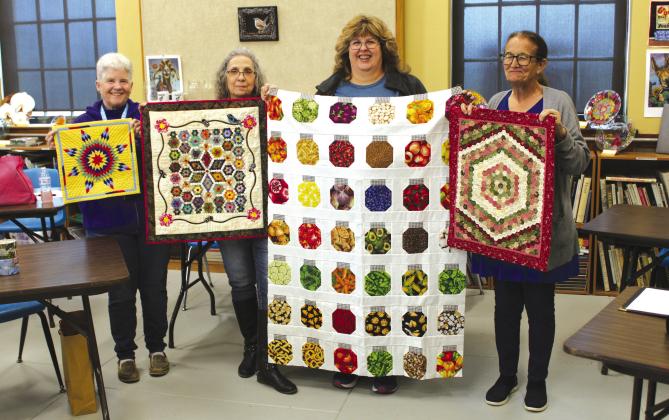 Members of the Quilt Guild show off their hand-made quilts during their regular meeting at the Bosque Arts Center in Clifton in February 2024. Nathan Diebenow | The Clifton Record
