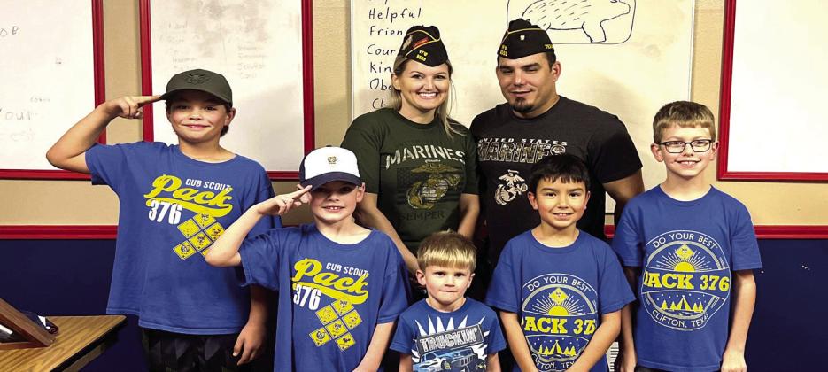 Veterans Keith and Erin Baker (back row, from left) spoke to the Cub Scouts Pack #376 during the pack’s meeting on Tuesday, December 6. The scouts included (front row, from left) Colton Braddock, Charles McCain, Jayden McCain, Joey St. Peters, and Nolan Ivy. Courtesy Photo by Cub Scout Pack #376