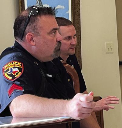 Meridian’s new chief of police Cody Woolsey (right) recommended a pay raise to Corporal Don Barron during the Meridian City Council’s called meeting on June 27. Nathan Diebenow | Meridian Tribune