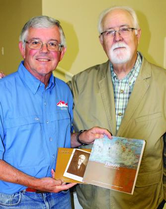 From left, Bosque County Genealogical and Historical Society president Jim Conrad proudly shows copies of Andy Wilkinson’s books about researching famous uncle, Charlie Goodnight. Ashley Barner | The Clifton Record
