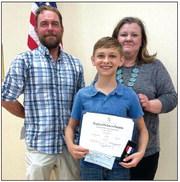 The “American History” contest award was given to Keaton Webber, a 5th grader at Clifton ISD (center) during DAR’s May meeting. He is pictured with his father (from left) and with Chapter Regent Liz Caraway.