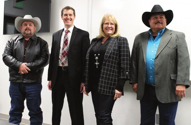 Ashley Barner | Meridian Tribune 12 a.m. New Year’s Day marked a new beginning for Bosque County as county officials were sworn into office. From left to right, Trace Hendricks, Luke Giesecke, Cindy Vanlandingham, and Billy Hall pose for photos after a brief ceremony at the Bosque County Sheriff’s Office.