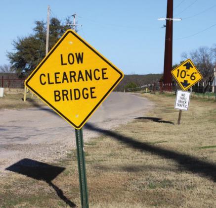 CR 3112, which runs along the Bosque River in Clifton, belongs in part to the city of Clifton and to Bosque County. Residents are frustrated with the amount of truck traffic ignoring posted signs, contributing to the poor conditions of the roadway. Ashley Barner | Meridian Tribune