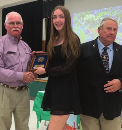 CHS sophomore Carly Howard receives a first place plaque at the Texas Soil and Water Conservation essay contest in Dublin. Courtesy Photo
