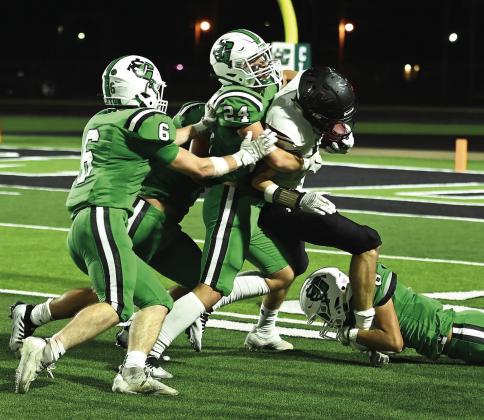 Clifton’s Carter Tunnel(6), Larrett Thomas(24) and Ervin Rodriguez take down a Millsap runner during Friday’s homecoming game. Photo Courtesy of Brett Voss’ The Sports Buzz