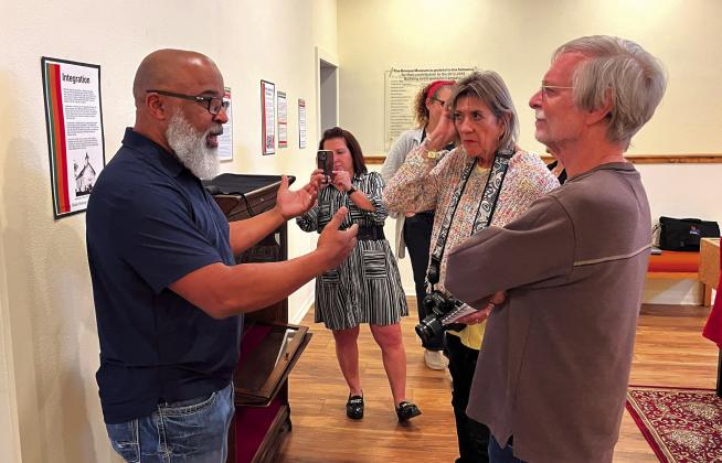 Thomas Oliver (from left) chats with Stacy Sadler, Bruce Wiland and, Donna Veteto at the opening reception of “Community: Black History in Bosque County,” a temporary exhibit at the Bosque Museum in Clifton on Wednesday, February 1, 2024. Nathan Diebenow | The Clifton Record