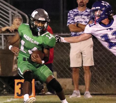 Morgan and Walnut Springs hash it out on the field as Hornet Jesse Lamb takes hold of Eagle Adrian Vera-Rico in Friday’s match-up. Photo by Wendy Orozco Courtesy of Brett Voss’ The Sports Buzz