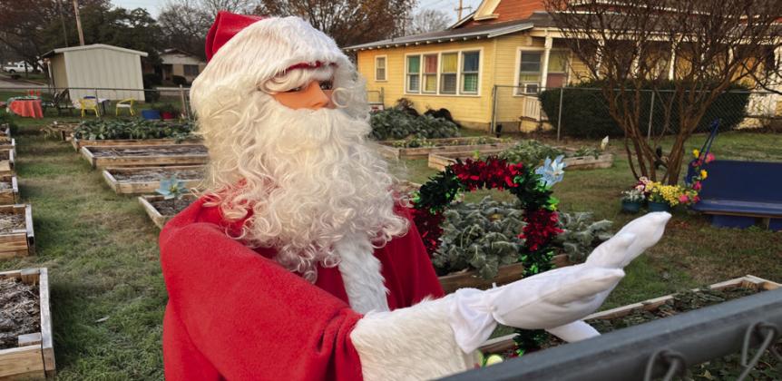 Santa Claus waves to traffic outside the Clifton Food Bank located at 303 South Avenue G. Nathan Diebenow | The Clifton Record